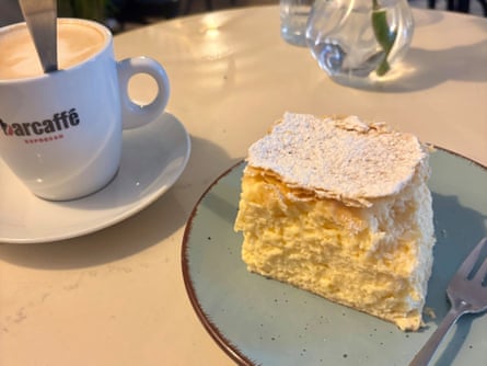 A custard cream cake topped with sugar.