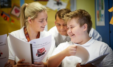 smiling teacher reading to child