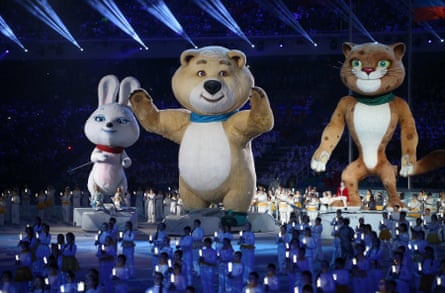 The hare, the polar bear and the leopard mascots say goodbye after extinguishing the Olympic flame during the 2014 Sochi Winter Olympics closing ceremony