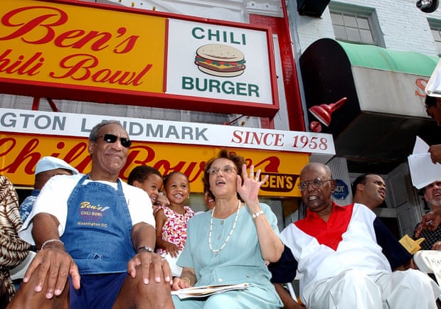 In a photo from 22 August 2003, Bill Cosby, left, joins Virginia Ali and Ben Ali for a celebration on the 45th anniversary of Ben’s Chili Bowl Restaurant.