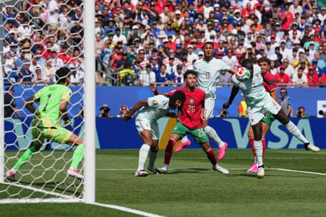 Dayot Upamecano gets his head on an early France chance.