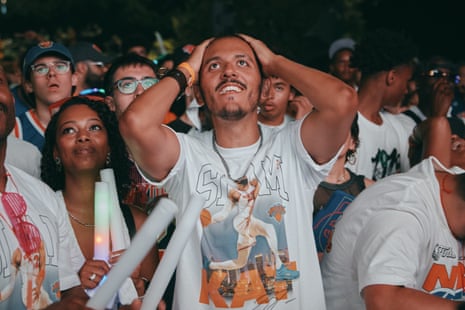 Knicks fans watch the game at an outdoor gathering in New York.
