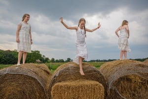On a farm in Kentucky, girls play during a break from a daylong mother-daughter retreat to help girls understand and appreciate their bodies as they change with the onset of puberty.