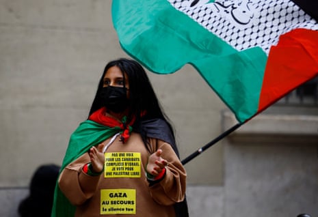A student holds a Palestinian flag near the Sorbonne university, 29 April.