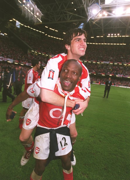 Lauren gives Cesc Fàbregas a lift after Arsenal win the 2005 FA Cup. Both were recommended by Francis Cagigao.