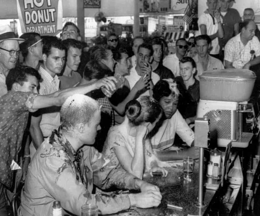 May 28, 1963: white people pour sugar, ketchup and mustard over heads of sit-in demonstrators at a Woolworth’s lunch counter in Jackson, Miss. Seated at the counter, from left, are John Salter, Joan Trumpauer and Anne Moody