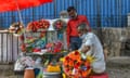 A florist prepares flower bouquets in Bengaluru on February 12, 2022, ahead of Valentine’s Day celebrations.