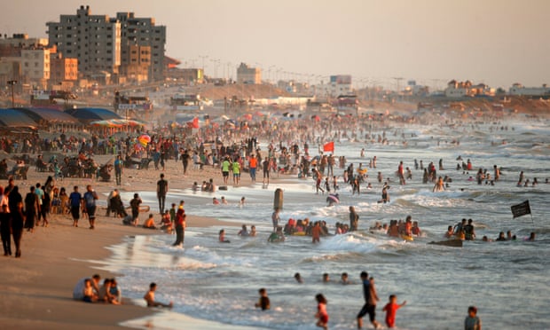 Residents of Gaza City cool off in the sea. Levels of contamination of the water have reached record levels this year.