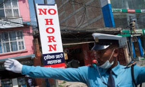 The sound of silence … a traffic coordinator on the streets of Kathmandu.