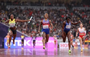 Sha’Carri Richardson of the United States (centre) celebrates after crossing the finish line to win the gold medal in the women’s 4x100m relay final followed by silver medalist Jonielle Smith of Jamaica (left) and fourth placed Daryll Neita of Great Britain (right).