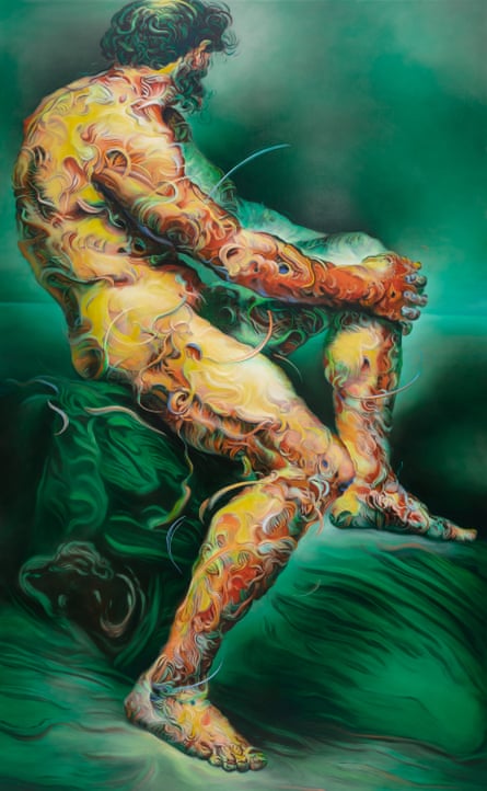 A lifesize nude male sits in a rustic setting, his skin a mass of decorative red and gold flourishes.