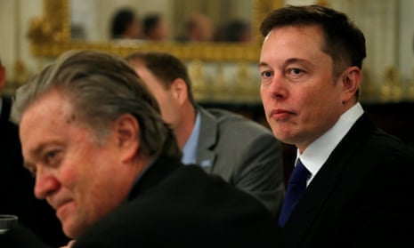 Tesla CEO Elon Musk sits beside Senior Counselor to the President Steve Bannon as US President Donald Trump hosts a strategy and policy forum with chief executives of major US companies.