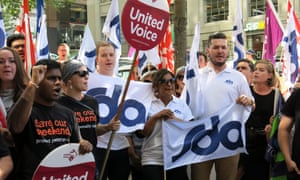 Protesters gather outside the Fair Work Commission offices in Melbourne’s CBD on Thursday after the decision to slash penalty rates for workers in some industries.