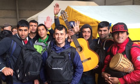 Calais camp clearance: Nine men from one village. Majit Nurzei is pictured on the far right, with the drum.