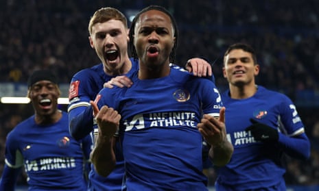 Chelsea's Raheem Sterling celebrates scoring their third goal with teammates.