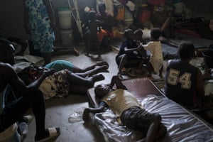 Families displaced by gang violence live in a shelter at a school in Petion-Ville in Port-au-Prince