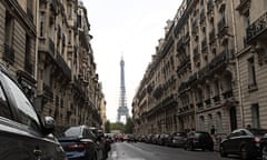 Cars parked in the street near the Eiffel Tower in Paris, France
