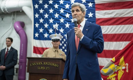 John Kerry addresses guests aboard the USS San Antonio. The US secretary of state is quoted as saying that any agreement at the Paris climate talks would not be a treaty. 
