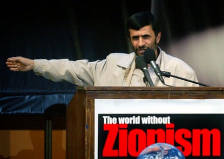 Mahmoud Ahmadinejad speaking at a lectern that says: ‘The world without Zionism’