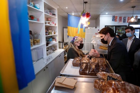 Prime Minister Justin Trudeau meets with bakery owner Maria Janchenko during a brief visit to Janchenko Bakery in Toronto, Thursday, March 17, 2022.