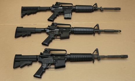 Three variations of an AR-15 rifle placed on a table