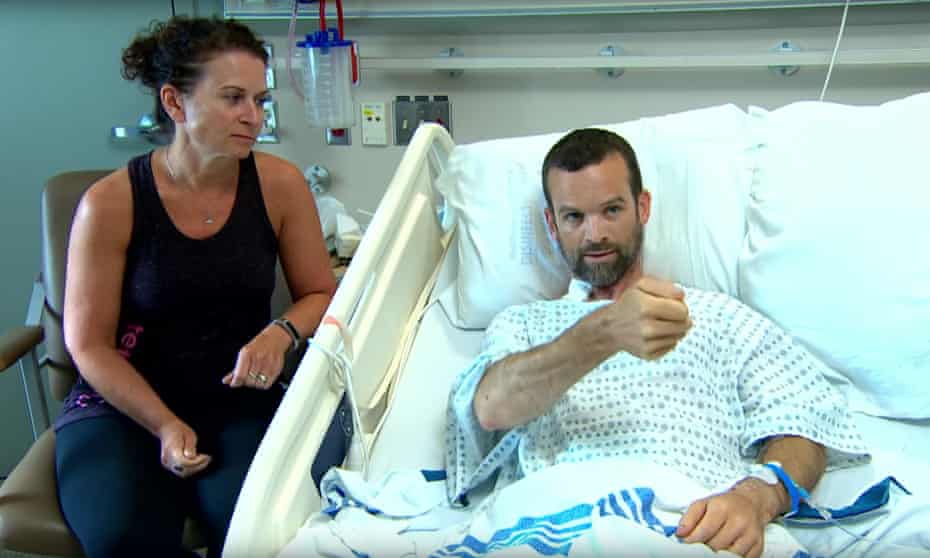 Colin Dowler in hospital next to his wife Jen. Dowler was mountain-biking at the time of incident. 
