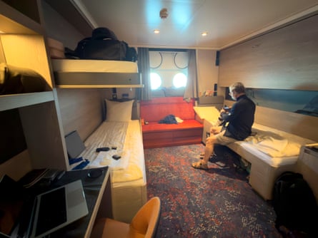 A passenger checks his camera inside his cabin on the MV Hondius on 6 May, 2026.