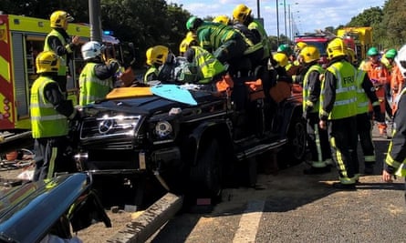 Paramedics and firemen extract Souaré from his car after the crash on the M4 motorway near Heathrow airport on 11 September 2016.