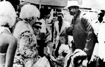 Ugandan president Idi Amin (wearing hat) talks to hostages released after the raid on Entebbe airport in July 1976