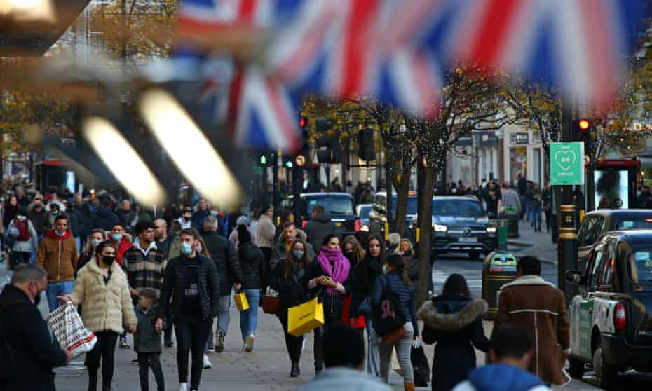 Shoppers walk along Oxford Street in central London.