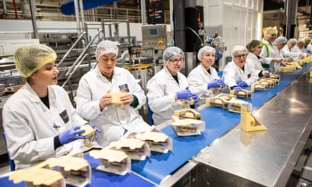 Chocolate sandwiches are prepared and packaged on a Hotel Chocolat production line.