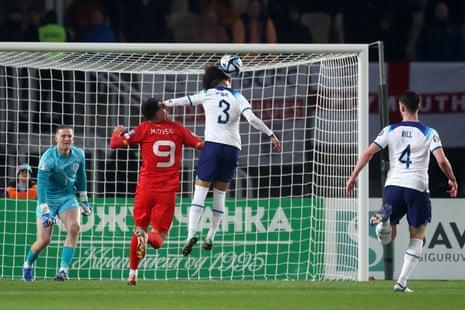 Bojan Miovski of North Macedonia is caught in the face by Rico Lewis of England.