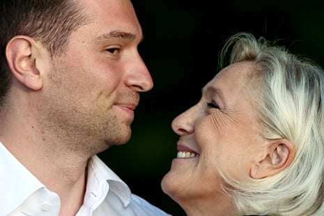 French far-right leaders Marine Le Pen and Jordan Bardella react after speaking at a country fair with supporters in Lievin, northern France.