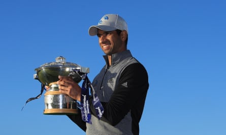 Aaron Rai shows off the Scottish Open trophy after beating Tommy Fleetwood on the first play-off hole at the Renaissance club.