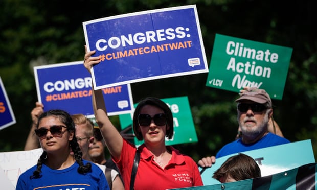 Activists rally for climate in Washington DC on 6 July. 