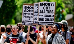 Student protesters with signs urging divestment from Israel on campus at Emory in Atlanta