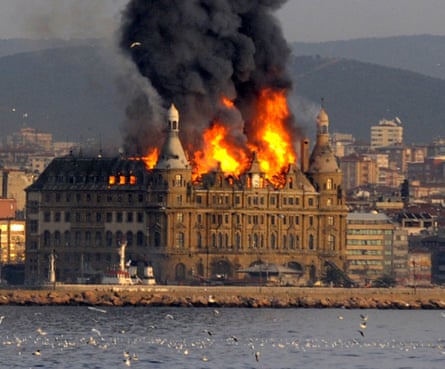 The blaze that engulfed the roof of Istanbul’s historic Haydarpasa train station building on the Asian side of the city of Istanbul, Turkey is seen from the Bosporus on Sunday, Nov. 28, 2010. Firefighters battled a blaze that engulfed the roof of Istanbul’s historic Haydarpasa train station building during restoration work Sunday, authorities said.(AP Photo)