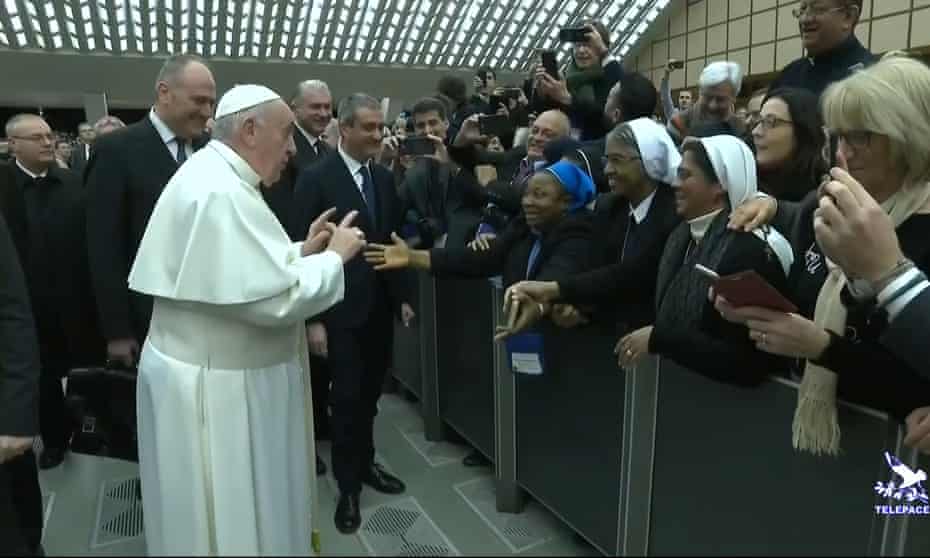 Pope Francis joking with a nun as he arrives for the general audience at the Vatican.