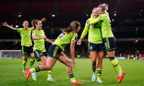 Manchester United's Alessia Russo (second from right) celebrates after her teammates score their third goal of the match.