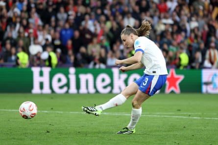 Niamh Charles puts England ahead in the shootout.