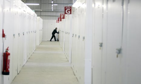 A customer moving possessions at a storage facility in Manchester