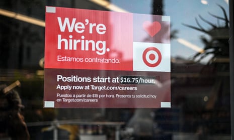 A sign advertising for new employees in the window of a Target store in Hollywood, California on November 9, 2021.