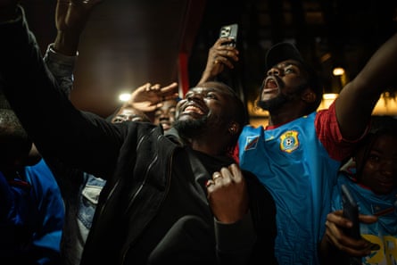 Congolese football fans gather to watch the broadcast of the Portugal vs Democratic Republic of Congo match.