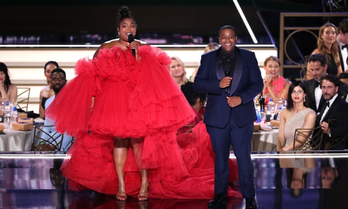 Lizzo and Kenan Thompson on stage.