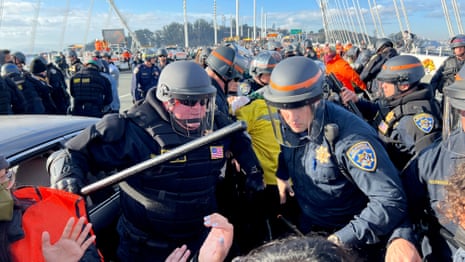 Police officers clear protesters blocking the San Francisco-Oakland Bay Bridge while demonstrating for a ceasefire in Gaza on Thursday, Nov. 16, 2023, in San Francisco.