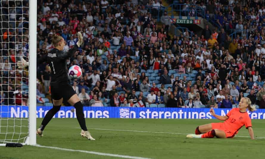 England's Beth Mead scores her second goal.