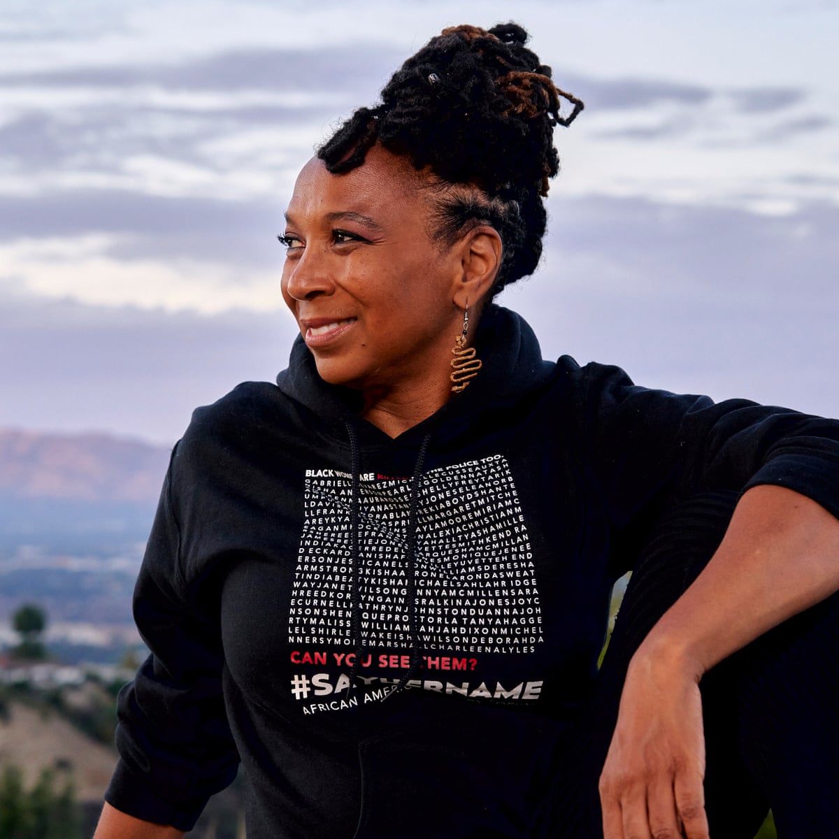 Scholar Kimberle Crenshaw wearing a black sweatshirt with the names of Black women memorialized by the #SayHerName movement