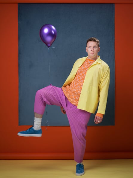 Balloon debate: Joe Lycett wears top by jacquemus.com; trousers and jacket by Homme Plisse (uk-store.isseymiyake.com); shoes by grenson.com; necklace by samhamdesign.com; and socks by uniqlo.com.
