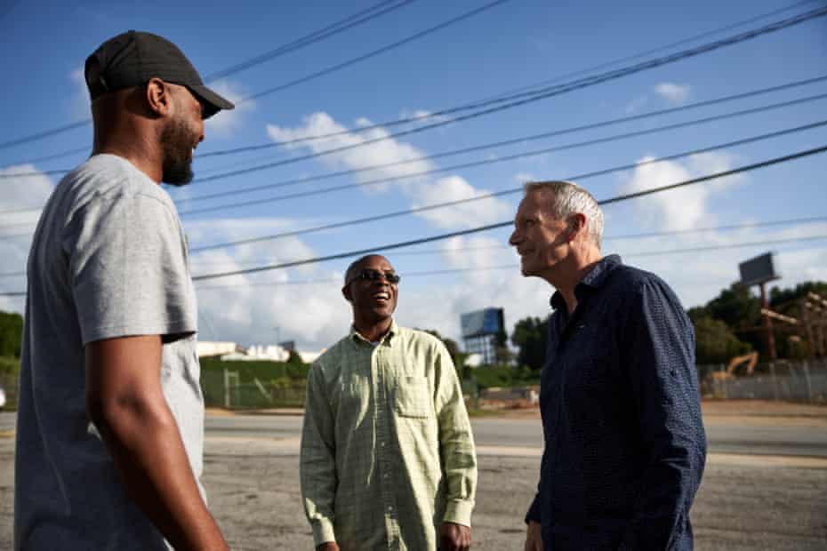 Devon Holloway and Tone Lane of the Pittsburgh Homeowners Association speak with a business owner across from the new Pittsburgh Yard development.