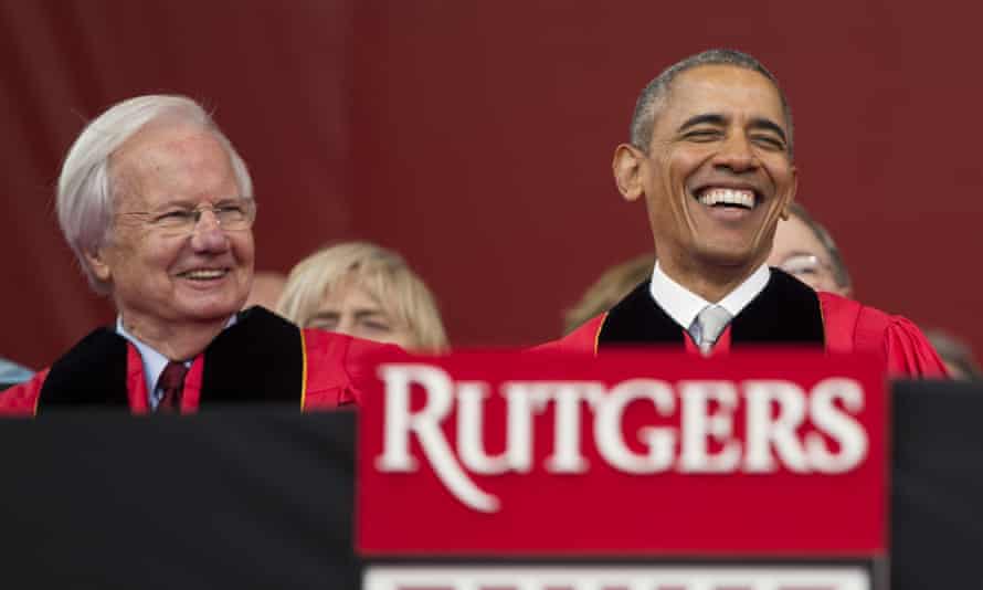 Obama, right, laughs as he sits with Bill Moyers during the ceremony.